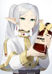  1girl blurry bottle cape commentary depth_of_field earrings english_commentary frieren gradient_background green_eyes grey_hair highres holding holding_bottle jewelry long_hair pointy_ears sasoura smile solo sousou_no_frieren striped_clothes thick_eyebrows twintails upper_body white_cape 