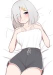  1girl absurdres blue_eyes breasts grey_hair hair_ornament hairpin hamakaze_(kancolle) highres kantai_collection lying one_eye_covered shirt short_hair shorts tiemu_(man190) white_shirt 