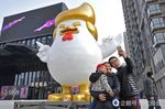 ambiguous_gender avian bird building chicken china chinese_text donald_trump female house human male mammal photo real selfie statute text unknown_artist year_of_the_rooster 