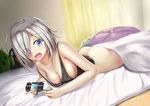  absurdres ashfair ass bare_shoulders bed bed_sheet blue_eyes bottomless breasts cleavage collarbone controller curtains embarrassed eyebrows_visible_through_hair eyes_visible_through_hair fingernails game_controller hair_ornament hair_over_one_eye hairclip hamakaze_(kantai_collection) highres holding indoors kantai_collection long_fingernails looking_at_viewer lying medium_breasts nail_polish no_bra no_panties on_bed on_stomach open_mouth pink_nails playing_games short_hair silver_hair sleeveless solo strap_slip stuffed_animal stuffed_penguin stuffed_toy tank_top 