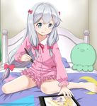  barefoot bed blue_eyes boku_wa_tomodachi_ga_sukunai bow drawing_tablet eromanga_sensei hair_bow hasegawa_kobato highres izumi_sagiri long_hair on_bed pajamas pillow pink_bow silver_hair sitting sitting_on_bed smile solo stuffed_animal stuffed_octopus stuffed_toy stylus telaform 