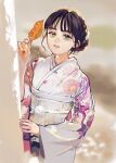  1girl absurdres black_hair green_eyes highres holding itsu_ninaku japanese_clothes kawasaki_sakura_(nogizaka46) kimono leaf nogizaka46 simple_background solo white_kimono 