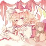  1girl ascot blonde_hair closed_mouth crystal_wings flandre_scarlet hat hat_ribbon looking_at_viewer mob_cap on_bed puffy_short_sleeves puffy_sleeves red_eyes red_ribbon ribbon short_sleeves side_ponytail solo sorani_(kaeru0768) stuffed_animal stuffed_toy teddy_bear touhou upper_body yellow_ascot 