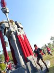  black_hair cosplay dy_chan fiora_laurent high_heels league_of_legends looking_at_viewer outdoor statue stockings turret 