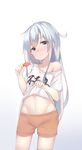 absurdres alternate_costume blue_eyes blush clothes_writing food gradient gradient_background hair_between_eyes hibiki_(kantai_collection) highres kantai_collection kure_(kure_ng) long_hair midriff off_shoulder orange_shorts popsicle shirt shirt_lift short_sleeves shorts silver_hair solo stomach sweat t-shirt white_background white_shirt 