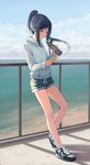  against_railing beach blue_eyes blue_hair breasts cellphone closed_mouth clothes_writing cloud cloudy_sky day digital_media_player earbuds earphones english expressionless full_body holding holding_phone hood hooded_sweater hoodie horizon huanxiang_heitu jpeg_artifacts leaning_back looking_down love_live! love_live!_sunshine!! matsuura_kanan new_balance ocean outdoors phone ponytail shoes short_shorts shorts sidelocks sky small_breasts smartphone sneakers socks solo sweater thermos 