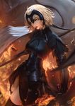  ahoge armor armored_dress black_armor black_legwear embers fate/grand_order fate_(series) fire gauntlets glowing glowing_eyes highres jeanne_d'arc_(alter)_(fate) jeanne_d'arc_(fate)_(all) looking_at_viewer parted_lips polearm raikoart short_hair smile solo spear sword thighhighs weapon yellow_eyes 