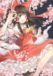  3000_xiao_chun blush bow brown_eyes brown_hair cherry_blossoms coin collarbone eyebrows_visible_through_hair hair_bow hair_tubes hakurei_reimu highres holding holding_coin looking_at_viewer navel open_mouth red_bow smile solo touhou 