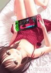  artist_name bangs barefoot bed_sheet blush brown_eyes brown_hair capriccio collarbone commentary dress eyebrows_visible_through_hair handheld_game_console joy-con knees_up legs long_hair looking_at_viewer lying nintendo_switch on_back on_bed open_mouth original playing_games polka_dot polka_dot_dress polka_dot_pillow red_dress smile solo splatoon_(series) splatoon_2 tears teeth thighs upside-down 