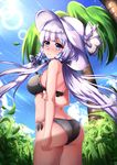  ass azur_lane bikini black_bikini blush breasts chahei commentary_request full-face_blush hair_tubes hat highres illustrious_(azur_lane) lavender_eyes lavender_hair lens_flare long_hair medium_breasts mole mole_under_eye palm_tree solo swimsuit tree 