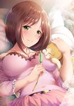  bed belt blush breasts brown_hair cat commentary_request garana green_eyes highres idolmaster idolmaster_cinderella_girls jewelry large_breasts lens_flare lying maekawa_miku necklace on_back short_hair smile solo toy 
