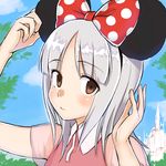  bow brave_witches brown_eyes castle disney disneyland edytha_rossmann emirio_(user_wmup5874) highres looking_at_viewer minnie_mouse_ears polka_dot polka_dot_bow silver_hair solo world_witches_series 