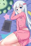  absurdres bangs blanket blue_eyes bow closed_mouth crescent drawing_tablet eromanga_sensei eyebrows_visible_through_hair frilled_shirt frilled_shorts frills from_above hair_bow highres izumi_sagiri long_hair looking_at_viewer looking_up lying on_bed on_side pajamas pink_bow pink_pajamas pink_shirt pink_shorts shirt shorts silver_hair solo star star_print stuffed_animal stuffed_octopus stuffed_toy stylus tablet tareme very_long_hair wavy_mouth xiaosamiao 