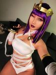  1girl bandage breasts cosplay dark_skin female menat menat_(cosplay) naked_bandage navel rinnie_riot street_fighter street_fighter_v winking 