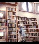  arms_behind_back blue_skirt book book_stack commentary hammer_and_sickle hat hibiki_(kantai_collection) kantai_collection ken_sogen letterboxed long_sleeves looking_away messy_hair school_uniform scribble serafuku shelf silver_hair skirt verniy_(kantai_collection) window window_shade 