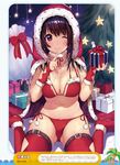  ;) bikini black_hair boots box breasts bridal_gauntlets christmas cleavage closed_mouth cross cross_necklace dengeki_moeou detached_collar eyebrows_visible_through_hair finger_to_mouth fingerless_gloves fur_trim gift gift_box glint gloves highres hood hoodie jewelry large_breasts matarou_(genkai_toppa) navel necklace non-web_source one_eye_closed purple_eyes red_bikini red_gloves red_legwear side-tie_bikini sitting smile solo star swimsuit thigh_boots thighhighs wariza 