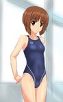  arena_(company) arms_behind_back breasts brown_eyes brown_hair competition_swimsuit cowboy_shot girls_und_panzer grey_swimsuit highres logo looking_at_viewer nishizumi_miho one-piece_swimsuit parted_lips short_hair small_breasts solo standing swimsuit takafumi window 