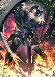  armor black_legwear blurry chain commentary_request depth_of_field fate/grand_order fate_(series) fire gauntlets glint grey_hair headpiece highres jeanne_d'arc_(alter)_(fate) jeanne_d'arc_(fate)_(all) kodama_(wa-ka-me) legs_apart looking_at_viewer parted_lips planted_sword planted_weapon short_hair smile solo standard_bearer standing sword teeth thighhighs tsurime weapon yellow_eyes 