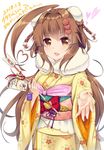  2018 alternate_hairstyle arrow brown_eyes brown_hair dated double_bun ema floral_print flower furisode hair_flower hair_ornament hamaya highres japanese_clothes kantai_collection kimono ko_yu kuma_(kantai_collection) long_hair long_sleeves new_year obi sash smile solo text_focus wide_sleeves 