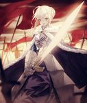  ahoge armor armored_dress artoria_pendragon_(all) blurry blurry_background capelet crying_eye depth_of_field fate/grand_order fate/zero fate_(series) fur_trim gloves green_eyes holding holding_sword holding_weapon looking_at_viewer red_flag saber short_hair sidelocks solo standing sword weapon 