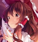  bangs bow brown_eyes brown_hair closed_mouth commentary commission english_commentary eyebrows_visible_through_hair face hair_bow hair_tubes hakurei_reimu hand_up hitsukuya holding long_hair ofuda red_bow smile solo touhou 