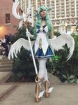  1girl alternate_costume alternate_eye_color alternate_hair_color alternate_hairstyle cosplay fluffy_ears gloves green_hair horn league_of_legends long_hair photo solo soraka star_guardian_soraka thighhighs very_long_hair white_gloves white_legwear white_wings wings 