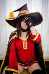  1girl asian bandage brown_eyes brown_hair cape choker cosplay covering_eye erect_nipples hat kneeling kono_subarashii_sekai_ni_shukufuku_wo! looking_at_viewer medium_hair megumin mismatched_legwear panties pantyshot photo thighs white_panties 