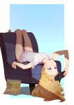  3four barefoot blonde_hair blue_eyes chair chips eating food gabriel_dropout handheld_game_console long_hair lying playstation_portable potato_chips shirt short_sleeves simple_background solo t-shirt tenma_gabriel_white upside-down white_shirt 