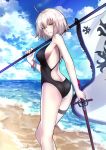  1girl ahoge ass backless_outfit bangle bangs banner bare_arms bare_shoulders beach black_swimsuit blue_sky bracelet breasts casual_one-piece_swimsuit cloud cloudy_sky day eyebrows_visible_through_hair fate/grand_order fate_(series) from_behind hair_between_eyes highres holding holding_sword holding_weapon horizon jeanne_d'arc_(alter)_(fate) jeanne_d'arc_(fate)_(all) jewelry large_breasts looking_at_viewer looking_back medium_hair ocean one-piece_swimsuit outdoors pale_skin parted_lips sand shiguru shiny shiny_hair sideboob silver_hair sky smile solo standing swimsuit sword thigh_strap weapon yellow_eyes 