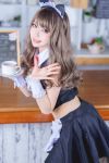  1girl asian brown_hair cat_ears cosplay dress japanese_(nationality) maid maid_headdress midriff solo waving 