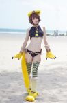  1girl animal_ears beach bodypaint cat_ears cat_tail cosplay egyptian gray_eyes mamono_girl_lover monster_girl monster_girl_encyclopedia ocean personification revealing_clothes solo sphinx sphinx_(mamono_girl_lover) sphinx_(monster_girl_encyclopedia) tail 