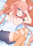  absurdres animal_ear_fluff animal_ears arms_up bike_shorts blue_eyes breasts cat_ears commentary_request fang hair_bobbles hair_ornament highres hinata_channel knees_up long_hair low_twintails lying mismatched_legwear nekomiya_hinata on_side open_mouth orange_legwear pillow pink_hair rokita shorts small_breasts smile solo striped striped_legwear thighhighs twintails vest white_vest wristband 