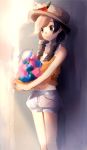  berry black_eyes blurry braid brown_hair floral_print food fruit halterneck hat highres holding long_hair midriff mizuki_(pokemon) navel pokemon pokemon_(game) pokemon_usum puffy_shorts ririmon shorts straw_hat tank_top twin_braids 