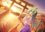  ahoge ass bare_shoulders blue_skirt broom cloud commentary detached_sleeves dutch_angle frog_hair_ornament from_behind gradient_sky green_eyes green_hair hair_ornament hair_tubes holding kochiya_sanae leaf long_hair long_sleeves looking_at_viewer looking_back nullpuni orange_sky parted_lips purple_sky revision shirt skirt sky sleeveless sleeveless_shirt snake_hair_ornament sunset touhou white_shirt wide_sleeves 