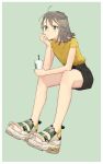  ahoge black_shorts blue_background blue_eyes commentary cup drinking_straw full_body grey_hair hand_on_own_chin highres misoni_comi original shirt shoes short_hair shorts simple_background sitting sneakers solo starbucks t-shirt yellow_shirt 