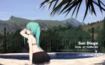  ass bikini bikini_skirt black_bikini black_skirt california commentary engrish_commentary fence from_behind green_eyes green_hair hair_between_eyes hatsune_miku highres leaning_forward long_hair looking_at_viewer looking_back mountainous_horizon nature outdoors poolside real_world_location san_diego sitting skirt sky solo swimsuit twintails vocaloid zhayin-san 