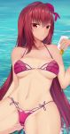  ass_visible_through_thighs bangs bikini breasts cleavage collarbone cowboy_shot eyebrows_visible_through_hair fate/grand_order fate_(series) feng_mouren flower hair_flower hair_intakes hair_ornament hibiscus highres large_breasts long_hair lotion lotion_bottle nail_polish navel ocean partially_submerged purple_bikini purple_hair red_eyes red_nails scathach_(fate)_(all) scathach_(swimsuit_assassin)_(fate) sunburn swimsuit 