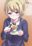  bangs black_neckwear blonde_hair blue_eyes blue_sweater blush braid brown_background closed_mouth commentary cup darjeeling dated dress_shirt emblem eyebrows_visible_through_hair gedoo_(gedo) girls_und_panzer highres holding holding_cup long_sleeves looking_at_viewer necktie saucer school_uniform shirt short_hair smile solo st._gloriana's_school_uniform sweater tea teacup tied_hair twin_braids twitter_username upper_body v-neck white_shirt wing_collar 