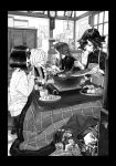  5girls apron braid carol_malus_dienheim chopsticks clock commentary_request doll_joints eating garie_tuman greyscale hairband highres inai_uchi kotatsu leiur_darahim long_hair micha_jawkan monochrome multiple_girls nabe phara_suyuf portable_stove senki_zesshou_symphogear short_hair sweater table tatami tied_hair 