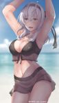  armpits arms_up bangs beach bikini black_bikini black_headband blue_eyes breasts cleavage cloud cloudy_sky collarbone commentary cowboy_shot day edwin_(cyberdark_impacts) english_commentary front-tie_top hachimaki hair_between_eyes headband kantai_collection large_breasts miniskirt navel ocean outdoors see-through silver_hair skirt sky solo suzutsuki_(kantai_collection) swimsuit 