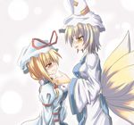  blonde_hair bow hat multiple_girls ribbon tail touhou yakumo_ran yakumo_yukari yuuji_(itadon) 