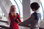  1boy 1girl bangs black_hair cosplay couple darling_in_the_franxx green_eyes hair_ornament hairband hetero hiro_(darling_in_the_franxx) hiro_(darling_in_the_franxx)_(cosplay) horns long_hair long_sleeves military military_uniform necktie oni_horns orange_neckwear pink_hair red_horns uniform white_hairband zero_two_(darling_in_the_franxx) zero_two_(darling_in_the_franxx)_(cosplay) 