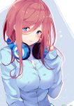  1girl absurdres bangs blue_cardigan blue_eyes blush breasts brown_hair closed_mouth collared_shirt flying_sweatdrops go-toubun_no_hanayome hair_between_eyes headphones headphones_around_neck highres kujou_ichiso large_breasts long_hair long_sleeves looking_at_viewer nakano_miku pout shirt solo upper_body white_shirt 