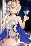  bangs bare_shoulders blonde_hair blue_eyes blue_flower blue_rose blush boots breasts cleavage collarbone commentary dress europa_(granblue_fantasy) eyebrows_visible_through_hair flower granblue_fantasy hair_between_eyes hair_flower hair_ornament head_tilt highres hinahino large_breasts looking_at_hand rose short_dress short_hair sidelocks sitting smile thighs tiara topaz_(stone) wariza white_dress white_footwear 