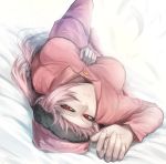  bed bed_sheet blush braid commentary_request fate/grand_order fate_(series) feathers florence_nightingale_(fate/grand_order) kanjou_jouki long_sleeves looking_at_viewer lying on_bed pajamas pink_hair red_eyes single_braid 