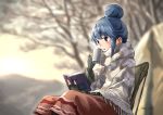  blue_hair blurry blurry_background book brown_eyes commentary cup eyebrows_visible_through_hair fingerless_gloves gloves hair_bun highres outdoors reading shawl shima_rin sitting solo steam translated tree_bowbow yurucamp 