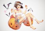  barefoot bat brown_eyes brown_hair candy claw_pose commentary_request eyebrows_visible_through_hair food gradient gradient_background hair_between_eyes halloween halloween_costume happy_halloween jack-o'-lantern kantai_collection liking looking_at_viewer nail_polish open_mouth pumpkin scar short_hair short_shorts shorts solo trick_or_treat yukikaze_(kantai_collection) 