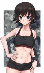  abs bangs black_shorts black_sports_bra blue_eyes blush breasts brown_hair camouflage_background cleavage closed_mouth commentary cowboy_shot emblem eyebrows_visible_through_hair girls_und_panzer gym_shorts hand_on_hip highres iron_cross looking_at_viewer mauko_(girls_und_panzer) medium_breasts navel outside_border shadow short_hair short_shorts shorts smile solo sports_bra standing toku_(yhpv8752) wristband 