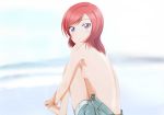  10s 1girl back backboob bare_back barefoot blurry blurry_background blush blush_stickers breasts kosu lens_flare looking_at_viewer looking_back love_live! love_live!_school_idol_project medium_breasts medium_hair nishikino_maki purple_eyes red_hair shorts sitting solo topless tsurime 