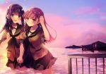  2girls :d bangs black_hair blunt_bangs braid brown_eyes brown_hair clenched_hand crane eyebrows_visible_through_hair green_neckwear green_serafuku green_skirt hair_braid hand_holding hand_in_hair holding_hands kantai_collection kitakami_(kantai_collection) long_hair multiple_girls nanahamu neckerchief ocean ooi_(kantai_collection) open_mouth partially_submerged pleated_skirt school_uniform serafuku short_sleeves sidelocks single_braid skirt smile sunset 